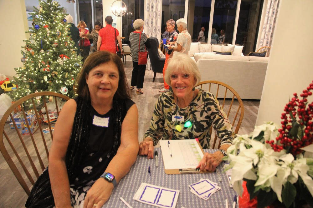 DWC Marco Holiday Social 2021 Sign In Table with Jane and Lisa